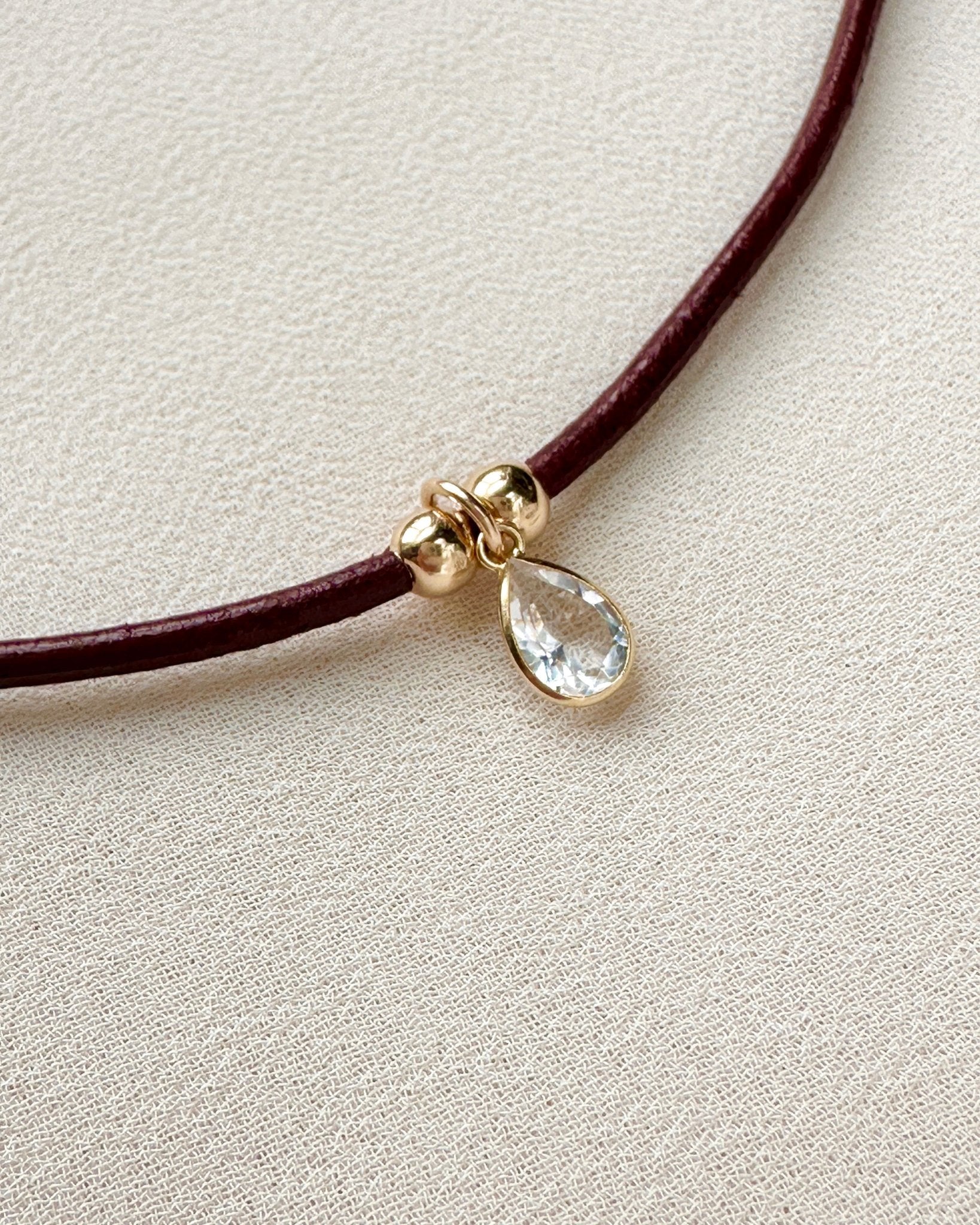emma necklace on burgundy leather cord with gold-filled details — gemstone pendant