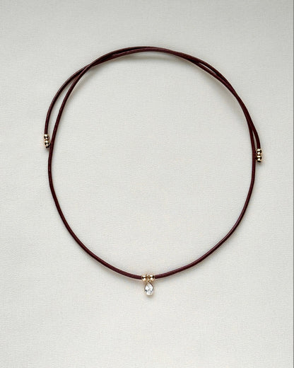 burgundy leather cord gemstone necklace laid flat — emma necklace