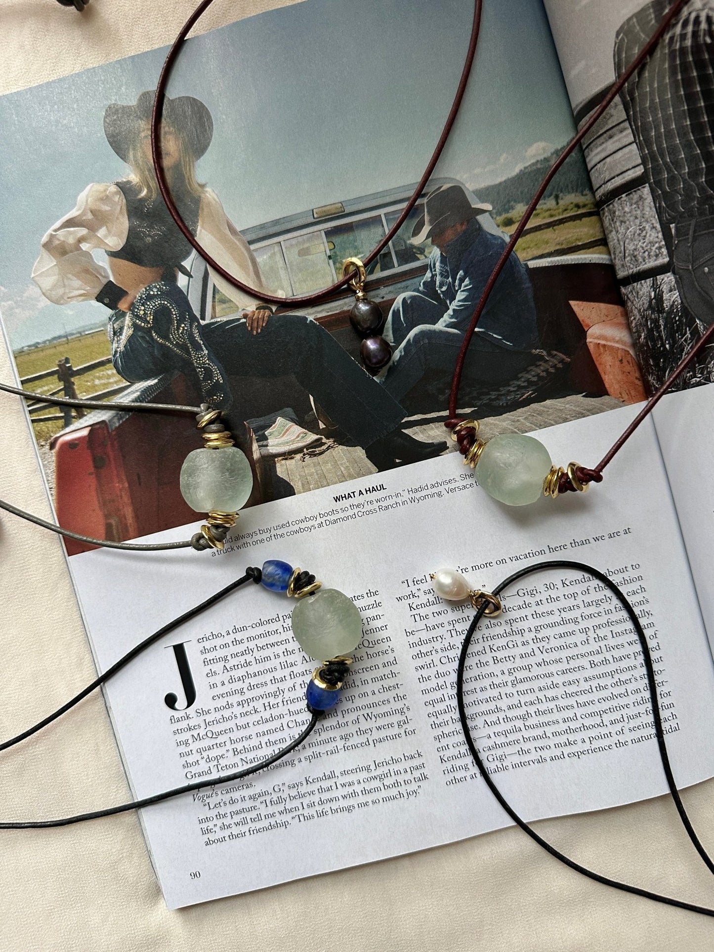Handmade leather cord necklaces on a magazine spread