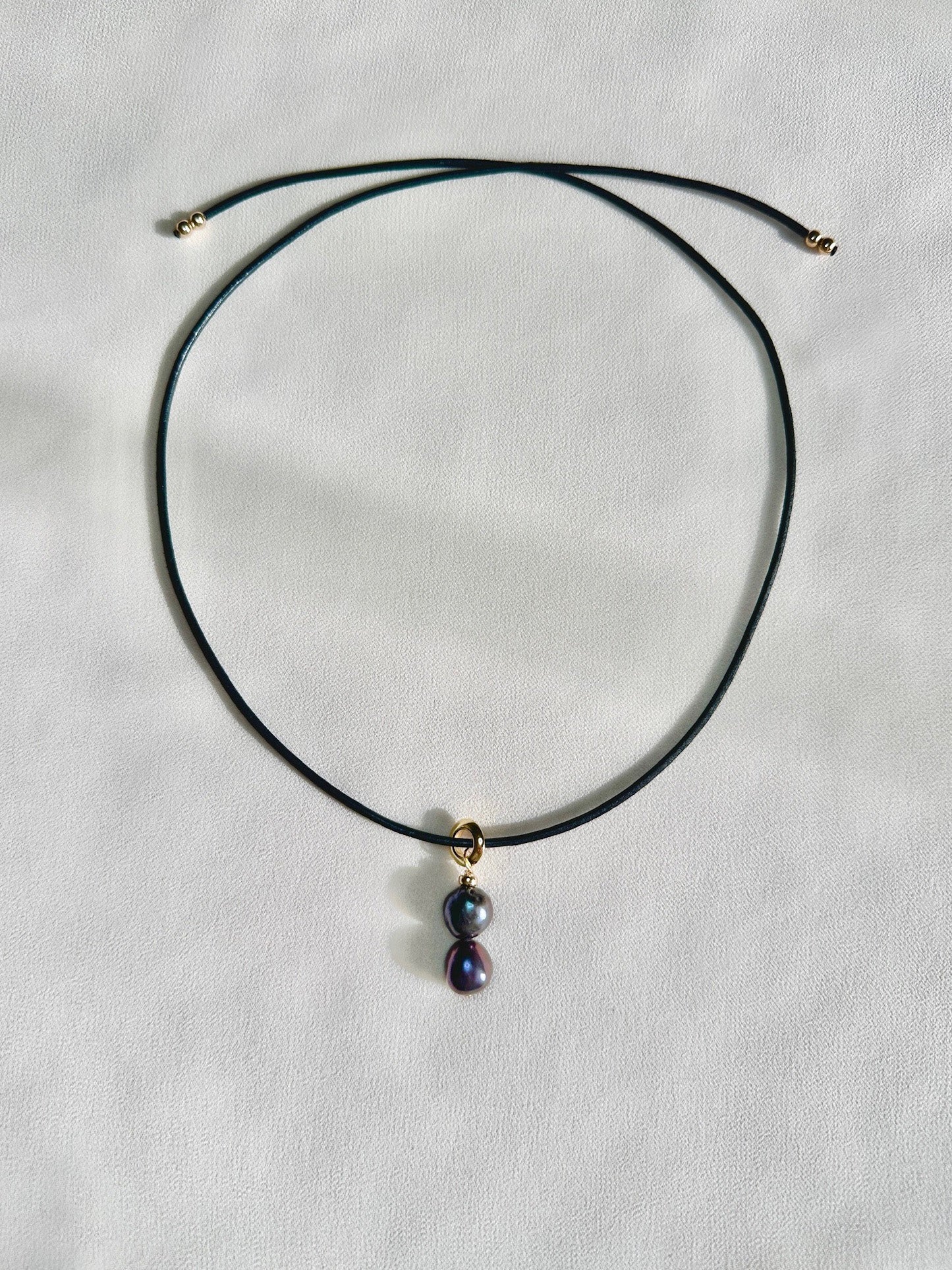 Shai leather cord necklace with dark freshwater pearl pendant