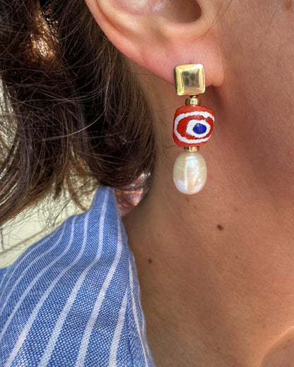 Close-up of Zina earrings on model